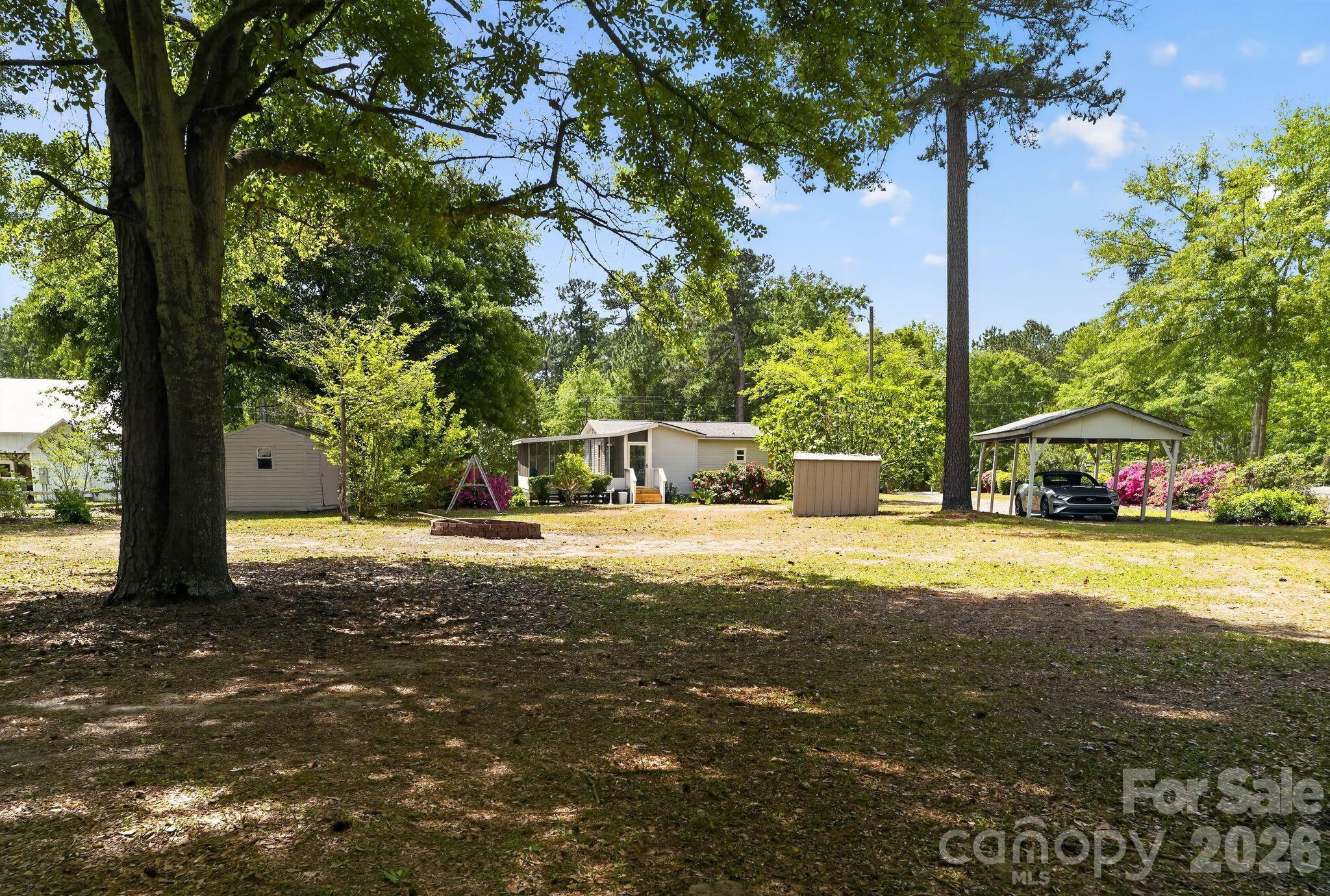 1724 Camp Shelor Road Manning, SC 29102 - Photo 33 of 48 a view of a street with a building and trees in the background