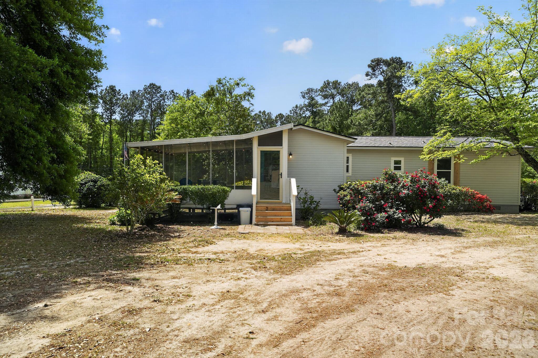 1724 Camp Shelor Road Manning, SC 29102 - Photo 36 of 48 a view of a house with backyard and sitting area