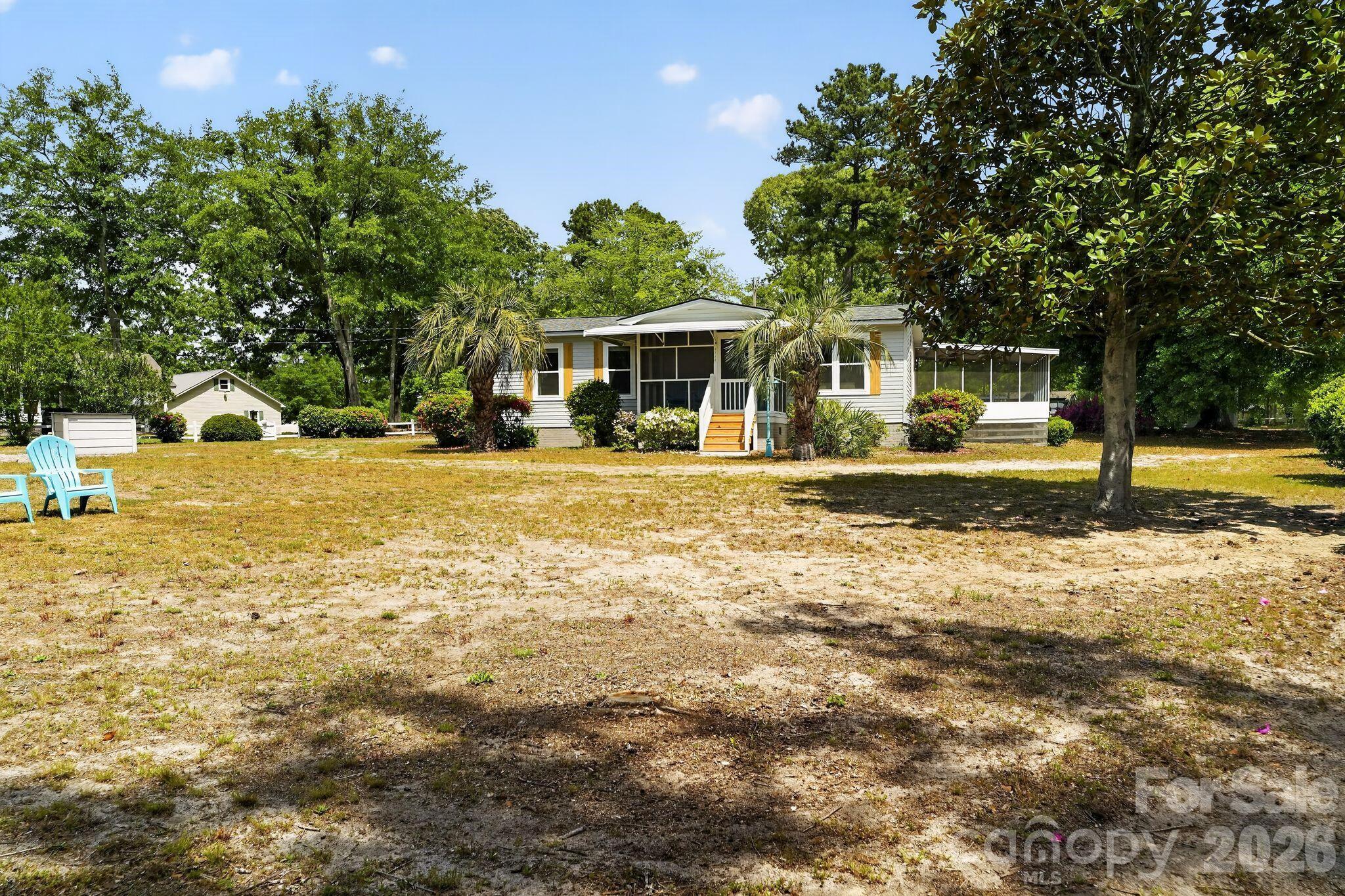 1724 Camp Shelor Road Manning, SC 29102 - Photo 37 of 48 a front view of a house with a yard