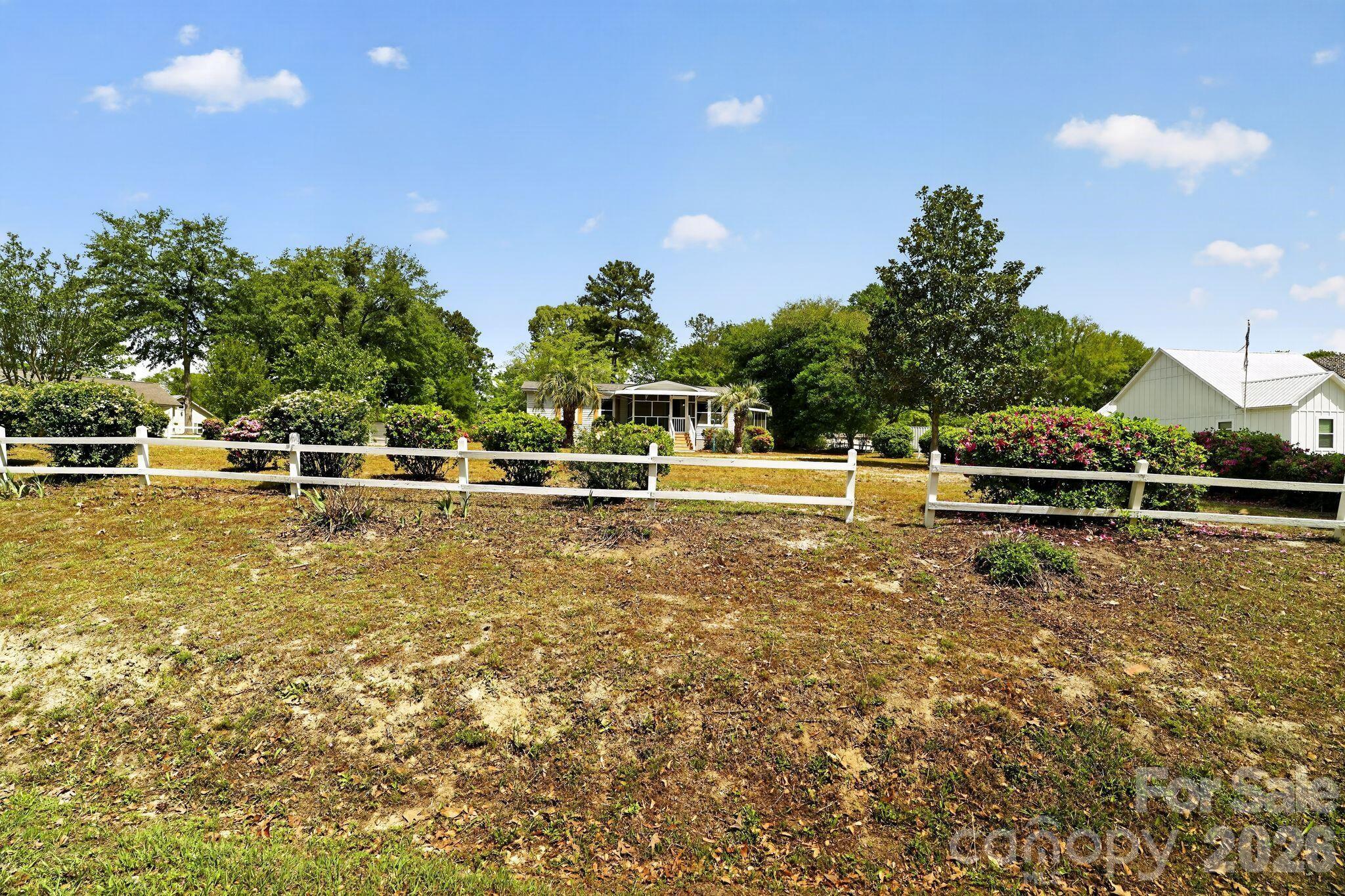 1724 Camp Shelor Road Manning, SC 29102 - Photo 41 of 48 a view of a swimming pool with an outdoor space and seating area