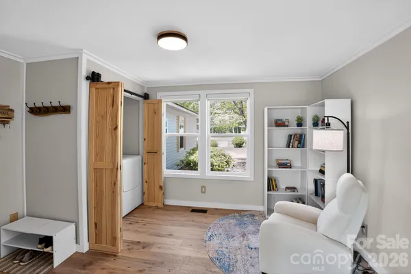 a dining room with furniture and window