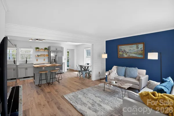 a living room with a sink and a window