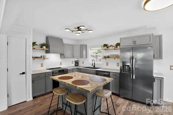 a outdoor space with patio the couches and dining table with garden view