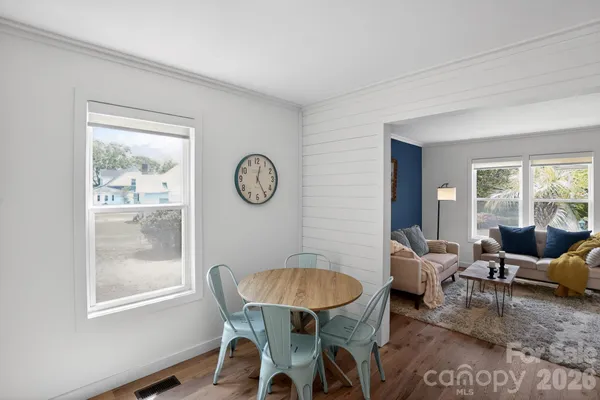 a view of a patio with a table and chairs