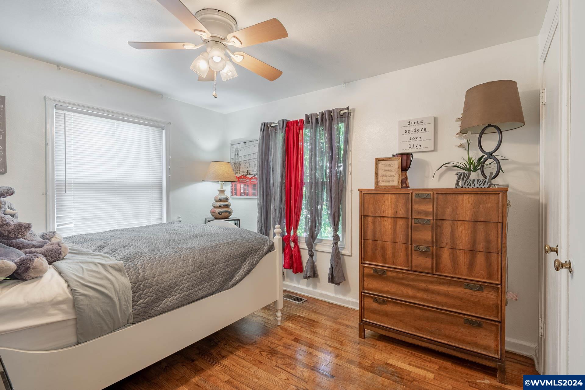 1530 2nd Avenue Albany, OR 97321 - Photo 20 of 35 a bedroom with a bed and a chandelier
