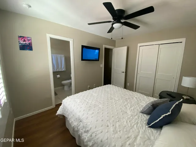 a bedroom with a bed and a view of bathroom