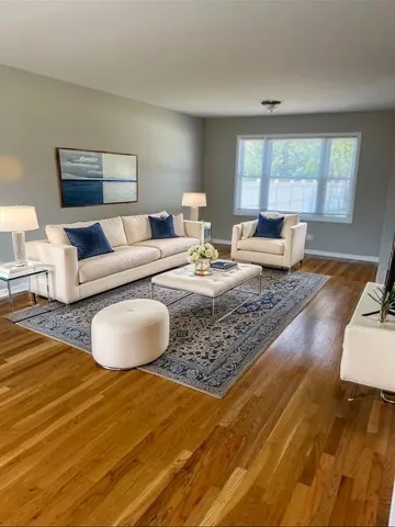a living room with furniture and a rug