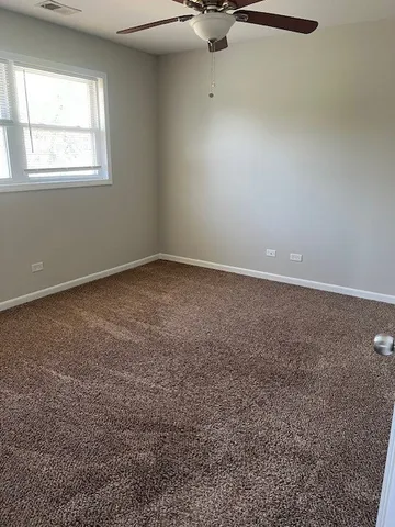 an empty room with a empty space and windows