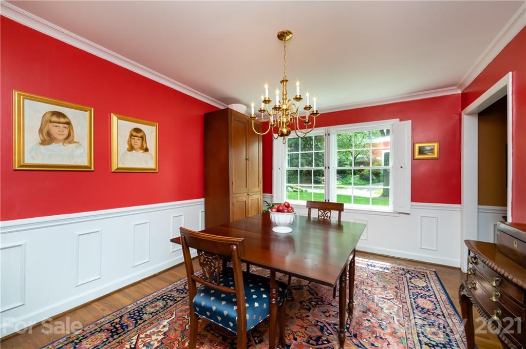 3216 Ferncliff Road Charlotte, NC 28211 - Photo 14 of 47 a view of a dining room with furniture and chandelier