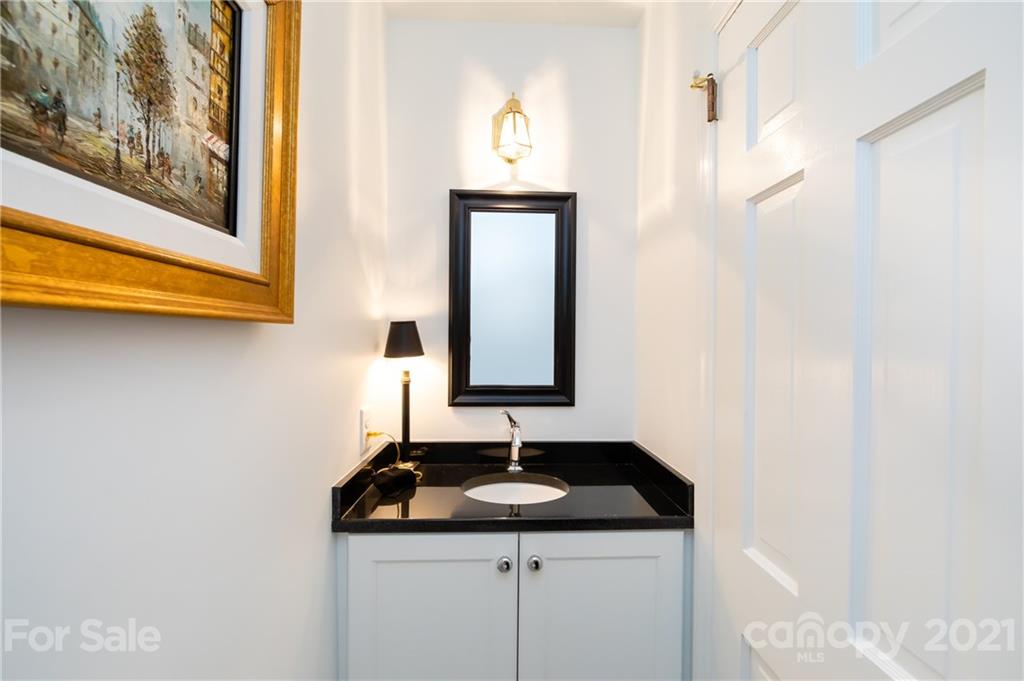 3216 Ferncliff Road Charlotte, NC 28211 - Photo 22 of 47 a bathroom with a sink and a mirror