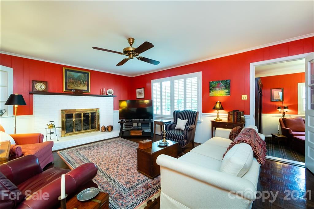 3216 Ferncliff Road Charlotte, NC 28211 - Photo 23 of 47 a living room with furniture a fireplace and a large window