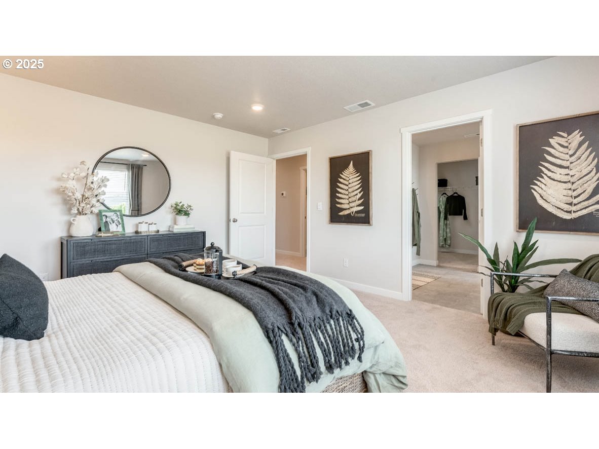 3609 Main Street Forest Grove, OR 97116 - Photo 22 of 29 a bedroom with a bed and a large mirror