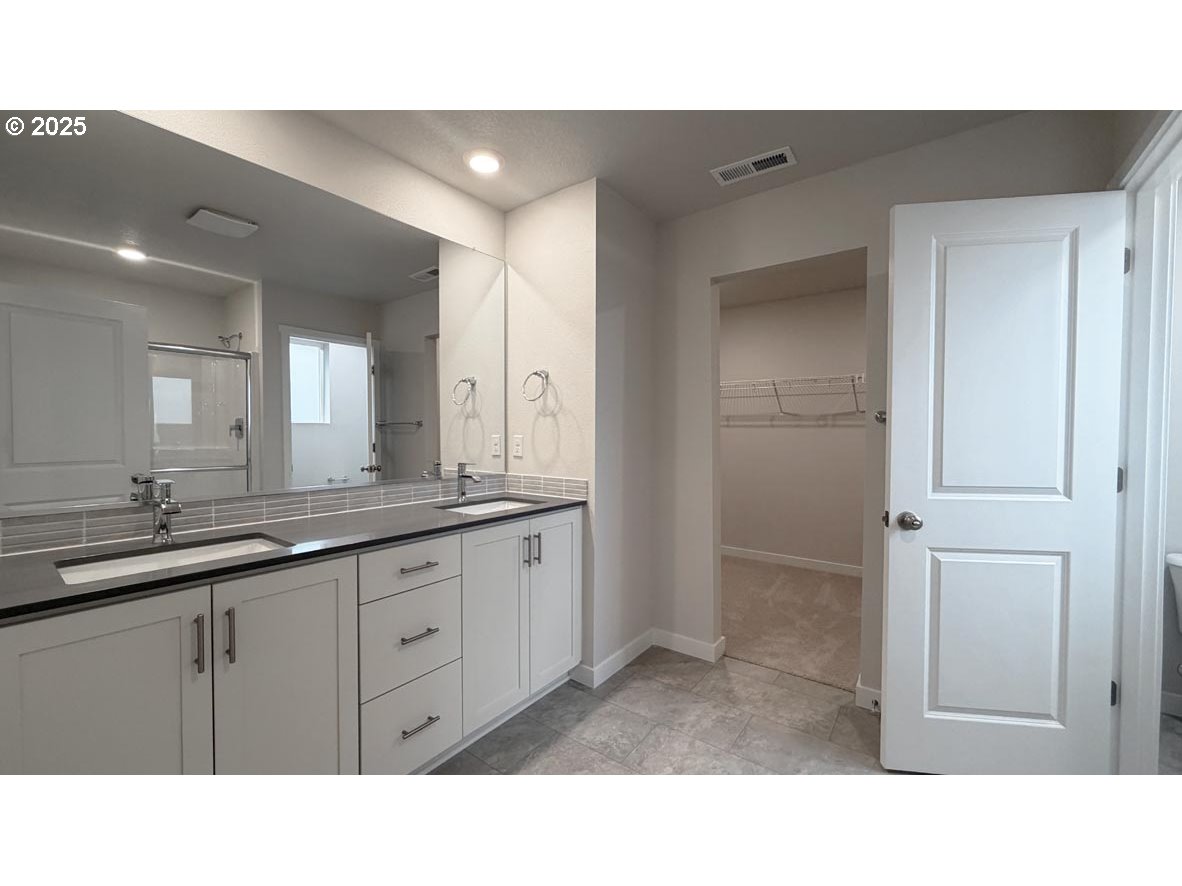 3609 Main Street Forest Grove, OR 97116 - Photo 29 of 29 a bathroom with a sink a mirror and a shower