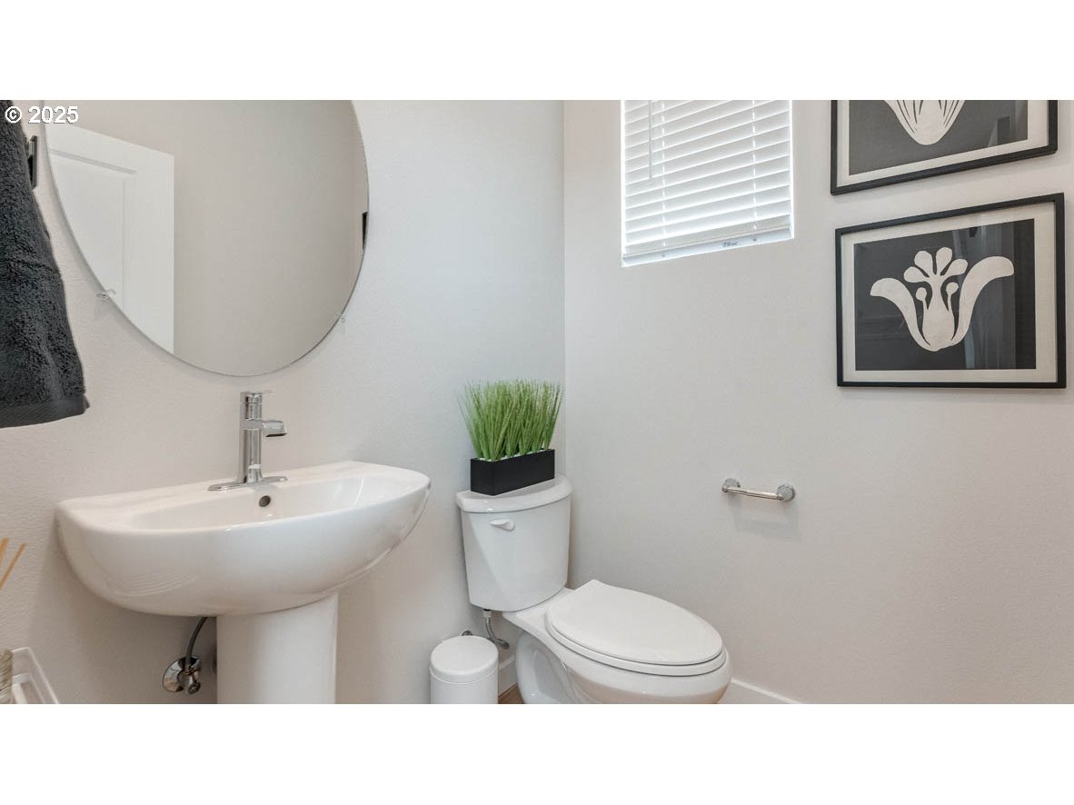3609 Main Street Forest Grove, OR 97116 - Photo 3 of 29 a bathroom with a sink toilet and mirror