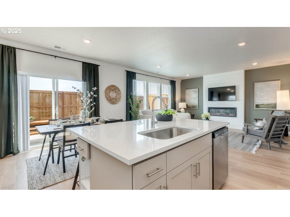 3609 Main Street Forest Grove, OR 97116 - Photo 8 of 29 a living room with furniture a flat screen tv and a table