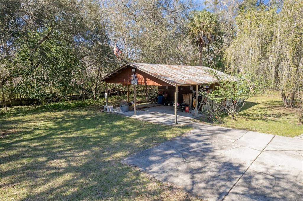 596 Highway 20 Palatka, FL 32177 - Photo 13 of 49 a view of a wooden house with a yard
