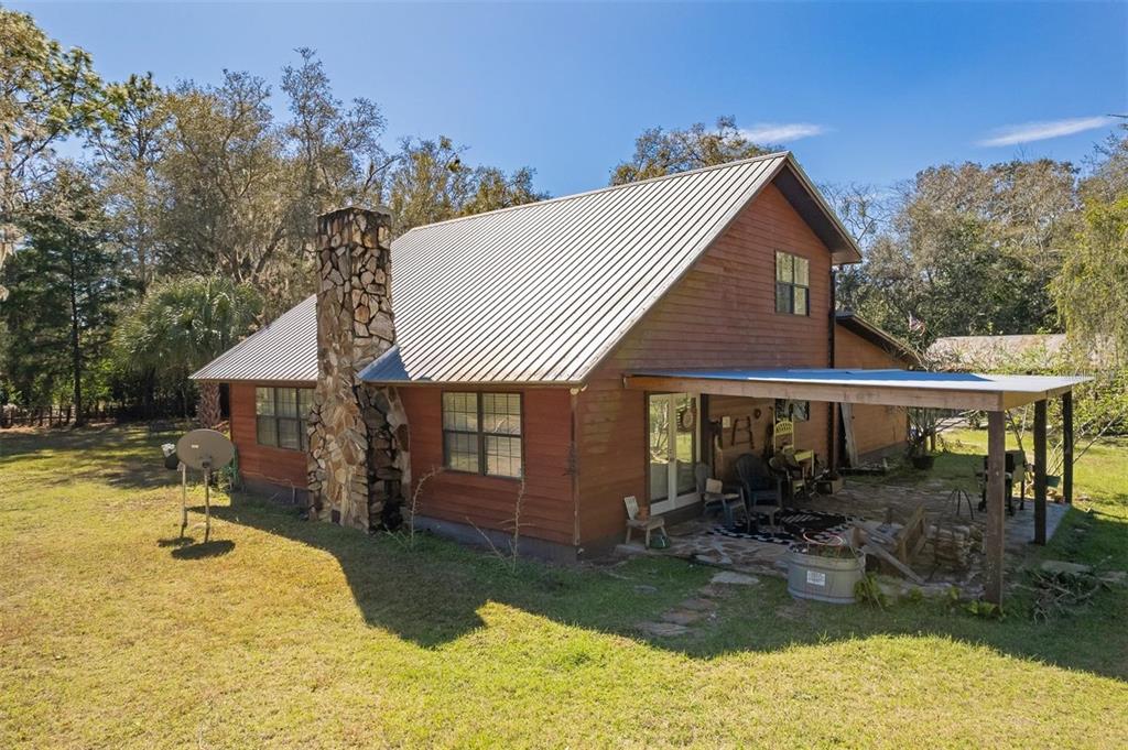 596 Highway 20 Palatka, FL 32177 - Photo 3 of 49 a view of a house with swimming pool and porch