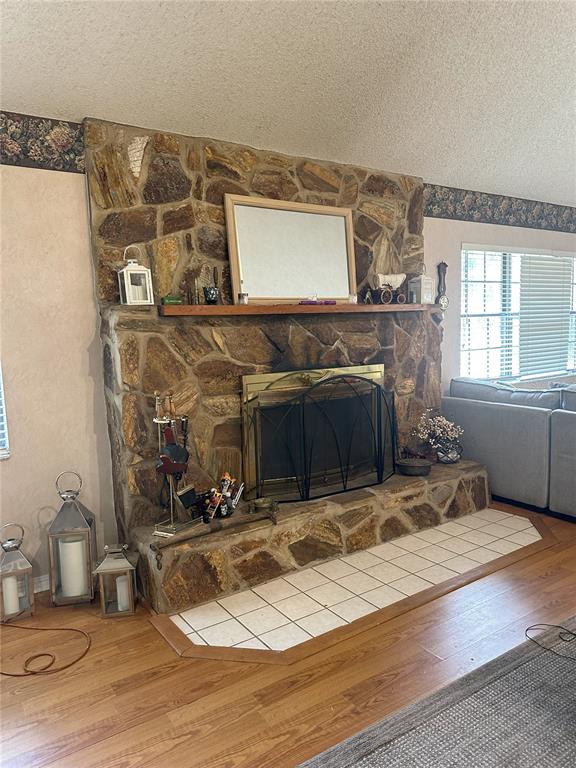 596 Highway 20 Palatka, FL 32177 - Photo 32 of 49 a room with a fireplace and wooden floor