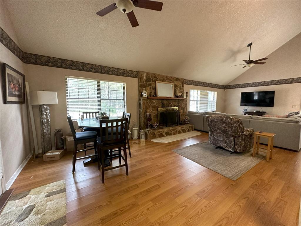 596 Highway 20 Palatka, FL 32177 - Photo 33 of 49 a living room with furniture flat screen tv and fireplace