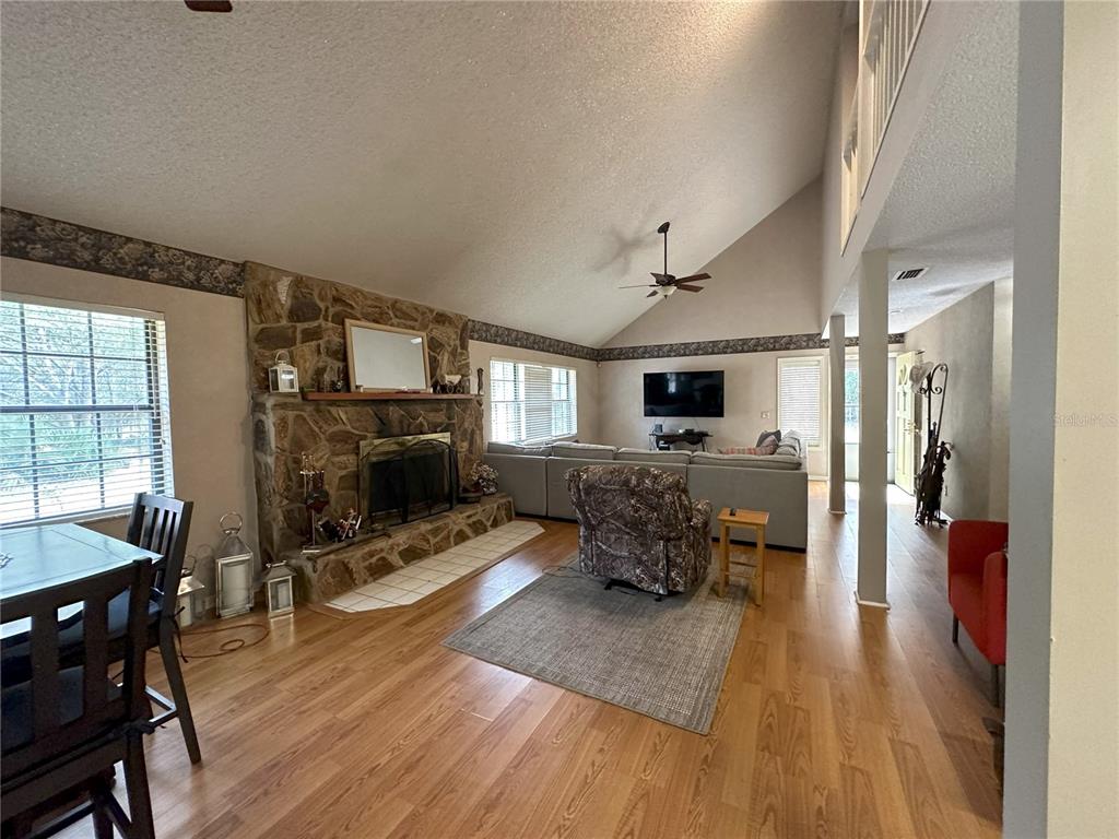 596 Highway 20 Palatka, FL 32177 - Photo 35 of 49 a living room with furniture flat screen tv and a fireplace