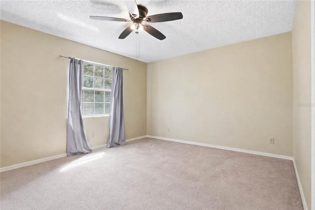 596 Highway 20 Palatka, FL 32177 - Photo 44 of 49 an empty room with windows and fan
