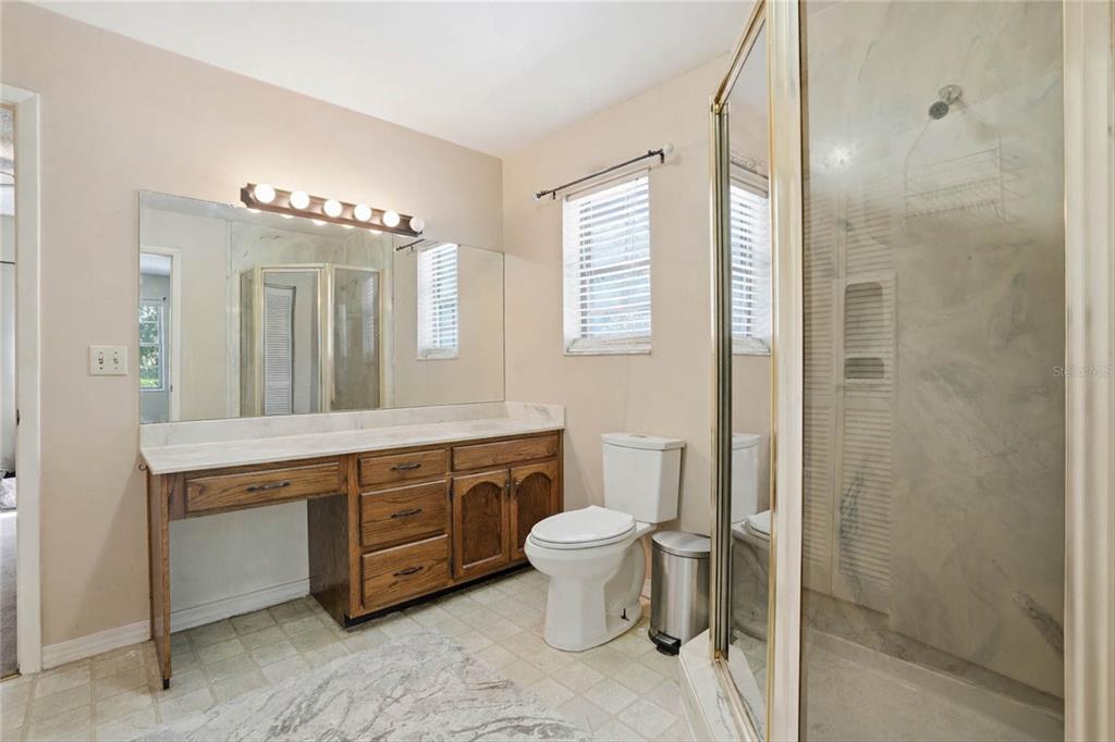 596 Highway 20 Palatka, FL 32177 - Photo 45 of 49 a spacious bathroom with a granite countertop sink toilet and shower
