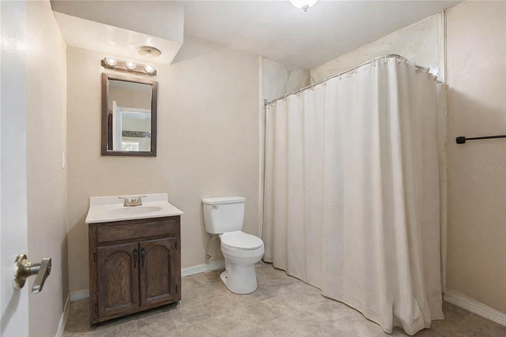 596 Highway 20 Palatka, FL 32177 - Photo 47 of 49 a bathroom with a sink mirror and toilet