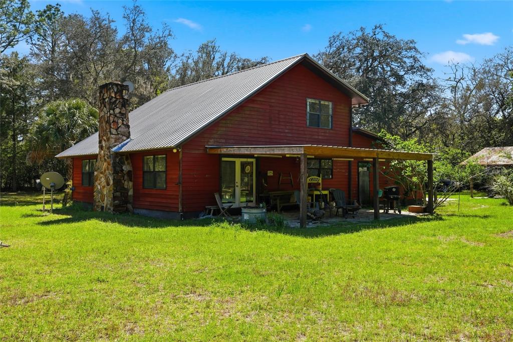 596 Highway 20 Palatka, FL 32177 - Photo 5 of 49 a view of a house with a yard and sitting area