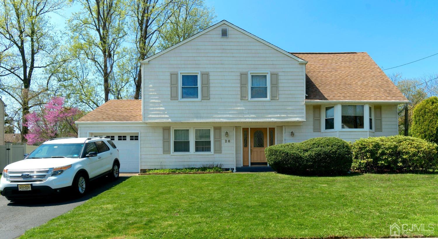 26 Phillips Road Edison, NJ 08817 - Photo 1 of 27 a front view of a house with a garden