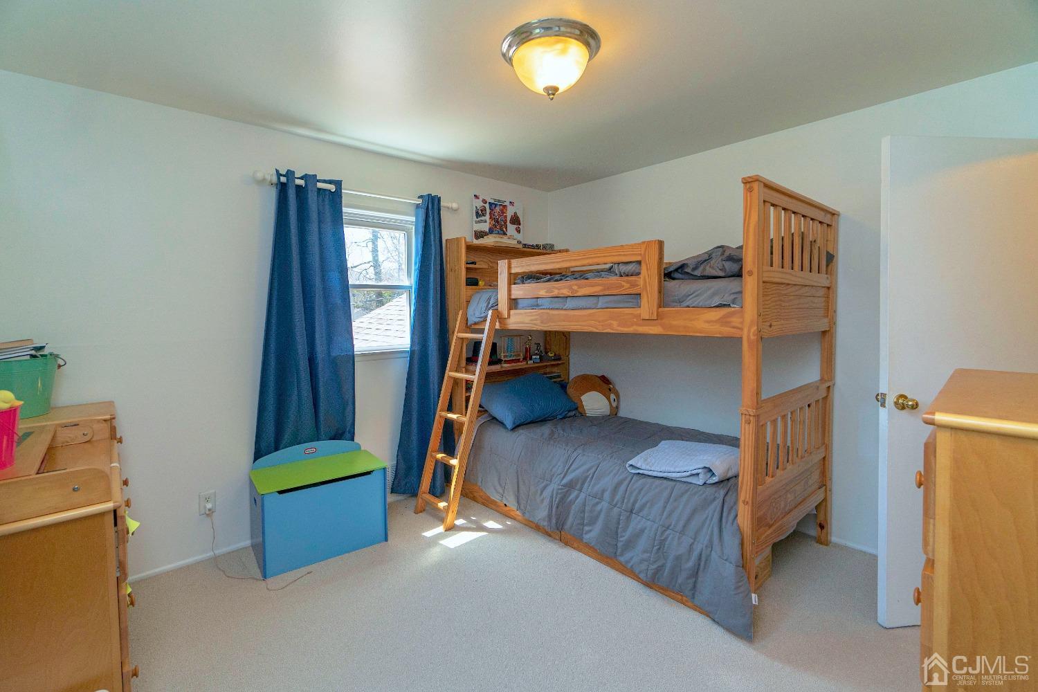 26 Phillips Road Edison, NJ 08817 - Photo 17 of 27 a bedroom with a bed and a window