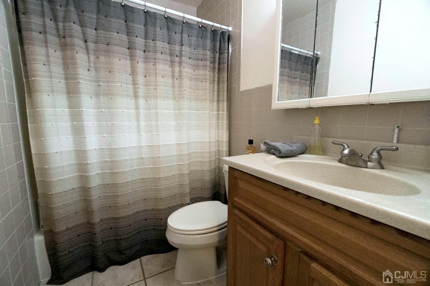 26 Phillips Road Edison, NJ 08817 - Photo 18 of 27 a bathroom with a sink a toilet and shower