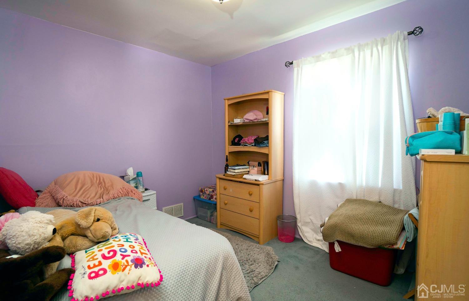 26 Phillips Road Edison, NJ 08817 - Photo 19 of 27 a bedroom with a bed and a window