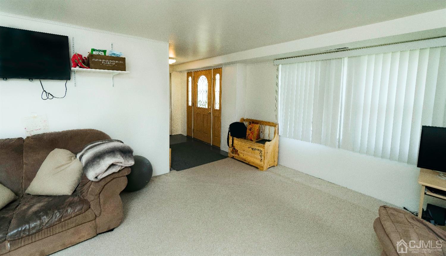 26 Phillips Road Edison, NJ 08817 - Photo 4 of 27 a living room with furniture and a flat screen tv