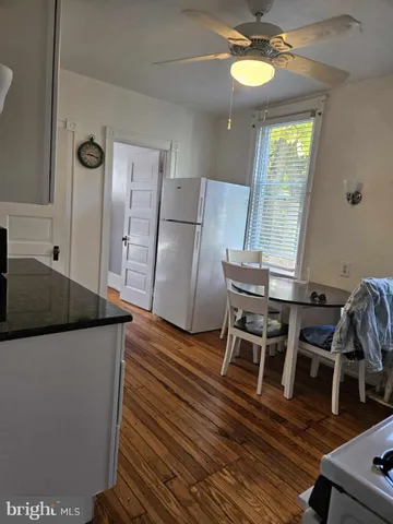 a kitchen with stainless steel appliances granite countertop a microwave a stove and a refrigerator