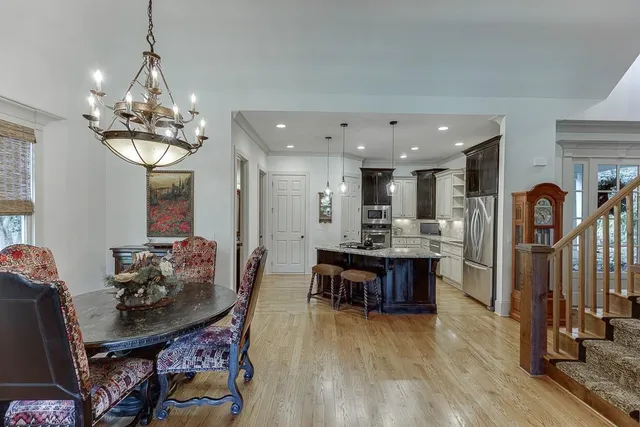 a bathroom with a granite countertop sink a mirror and shower