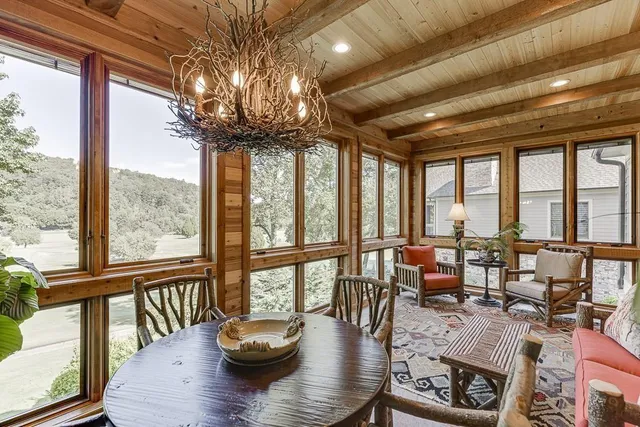 a bedroom with two beds and a large window