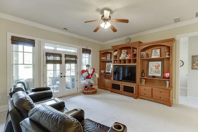 an aerial view of a house with a yard