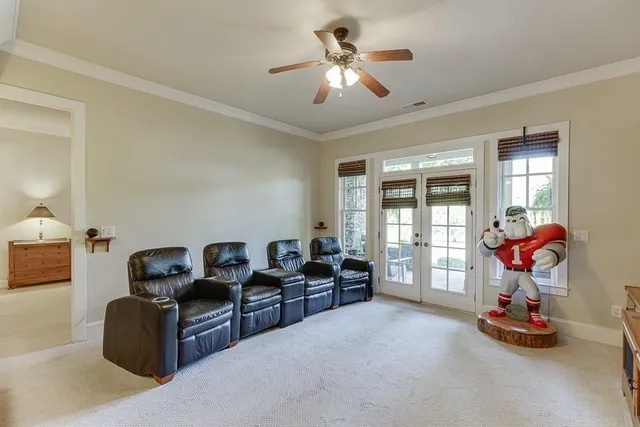 an aerial view of a house with a yard basket ball court and outdoor seating