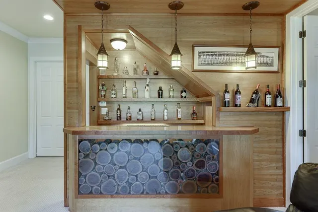an aerial view of green landscape with trees houses and mountain view