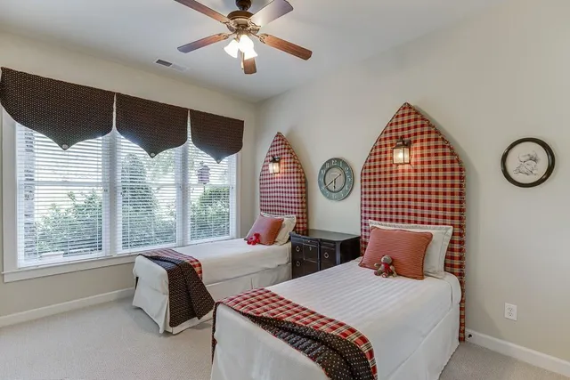 a view of a patio with table and chairs under an umbrella