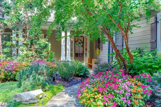 a living room with furniture fireplace and flat screen tv