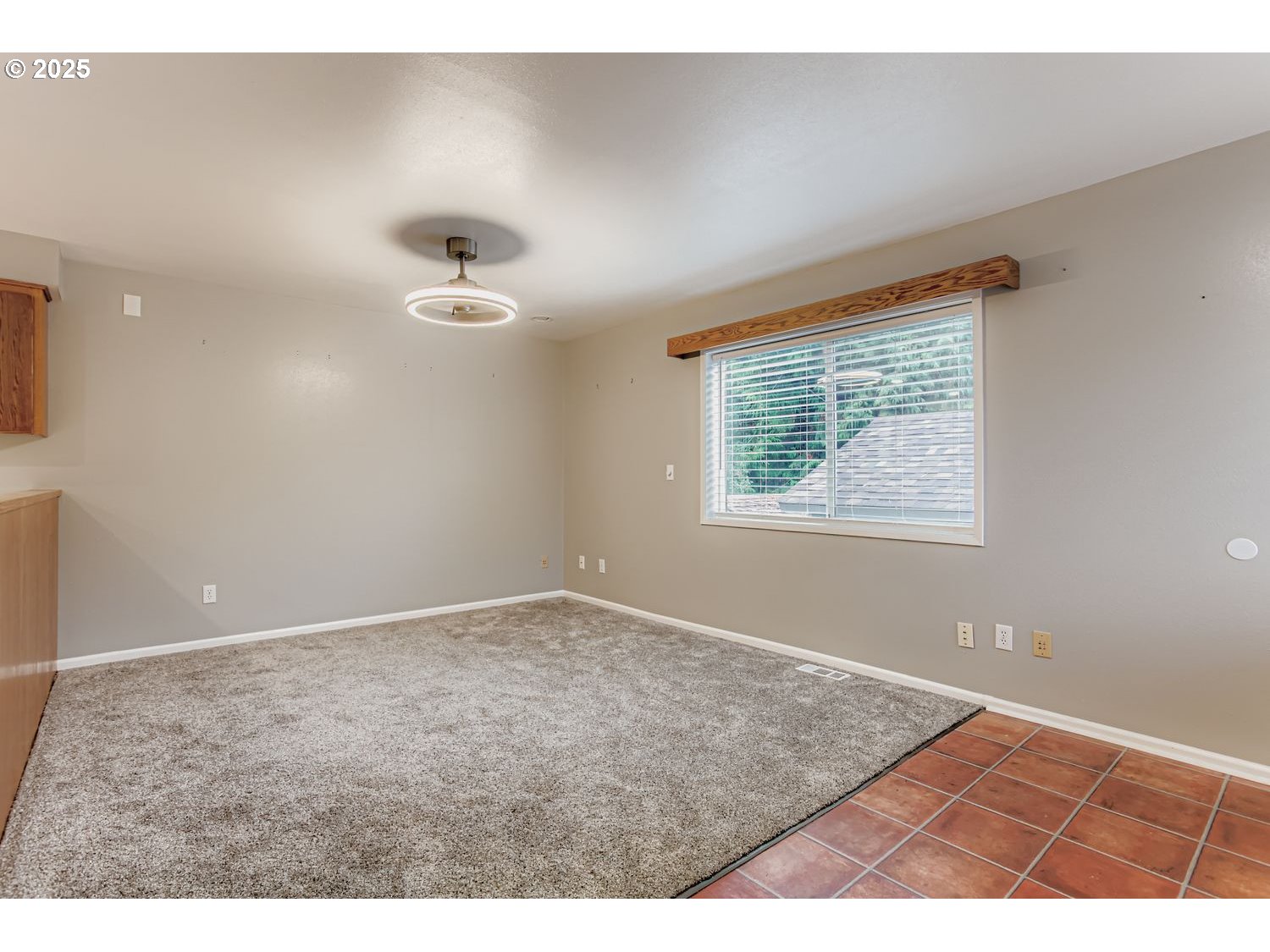 10832 Southeast Stephens Street Portland, OR 97216 - Photo 11 of 36 a view of an empty room with a window