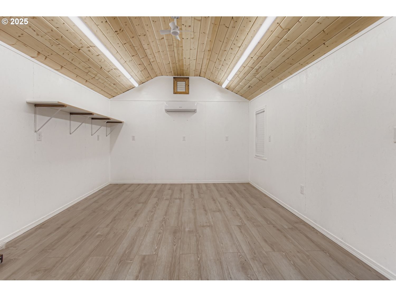 10832 Southeast Stephens Street Portland, OR 97216 - Photo 25 of 36 a view of an empty room with a window