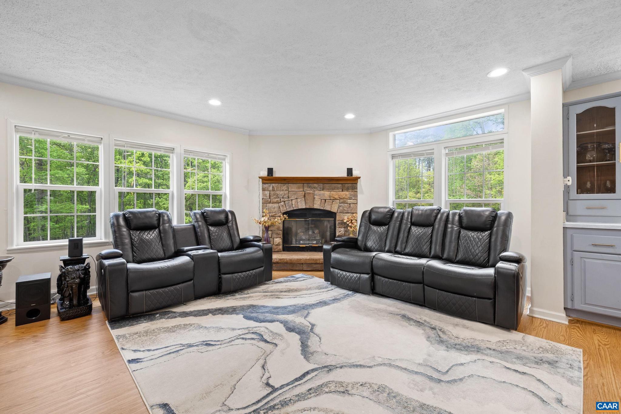 3151 Waldrop Church Road Louisa, VA 23093 - Photo 12 of 42 a living room with furniture a large window and a fireplace