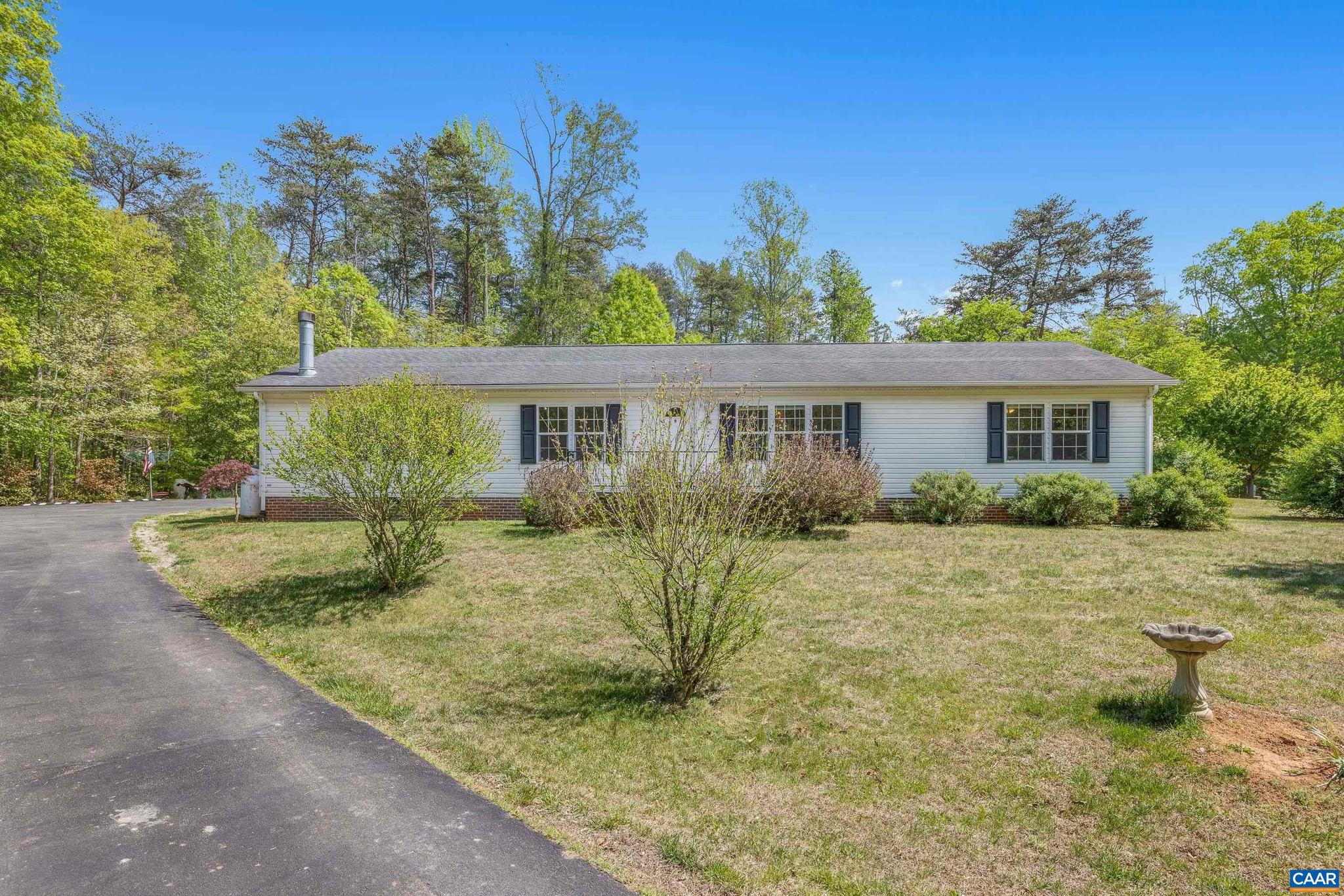 3151 Waldrop Church Road Louisa, VA 23093 - Photo 2 of 42 a view of a house with backyard and trees