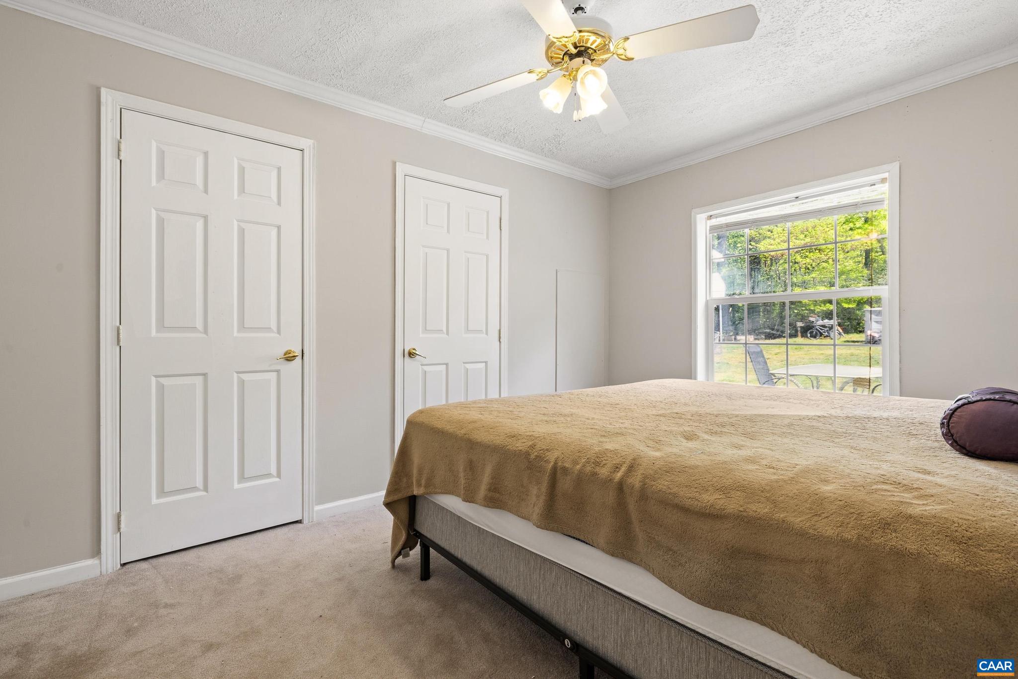 3151 Waldrop Church Road Louisa, VA 23093 - Photo 24 of 42 a bedroom with a bed and a window