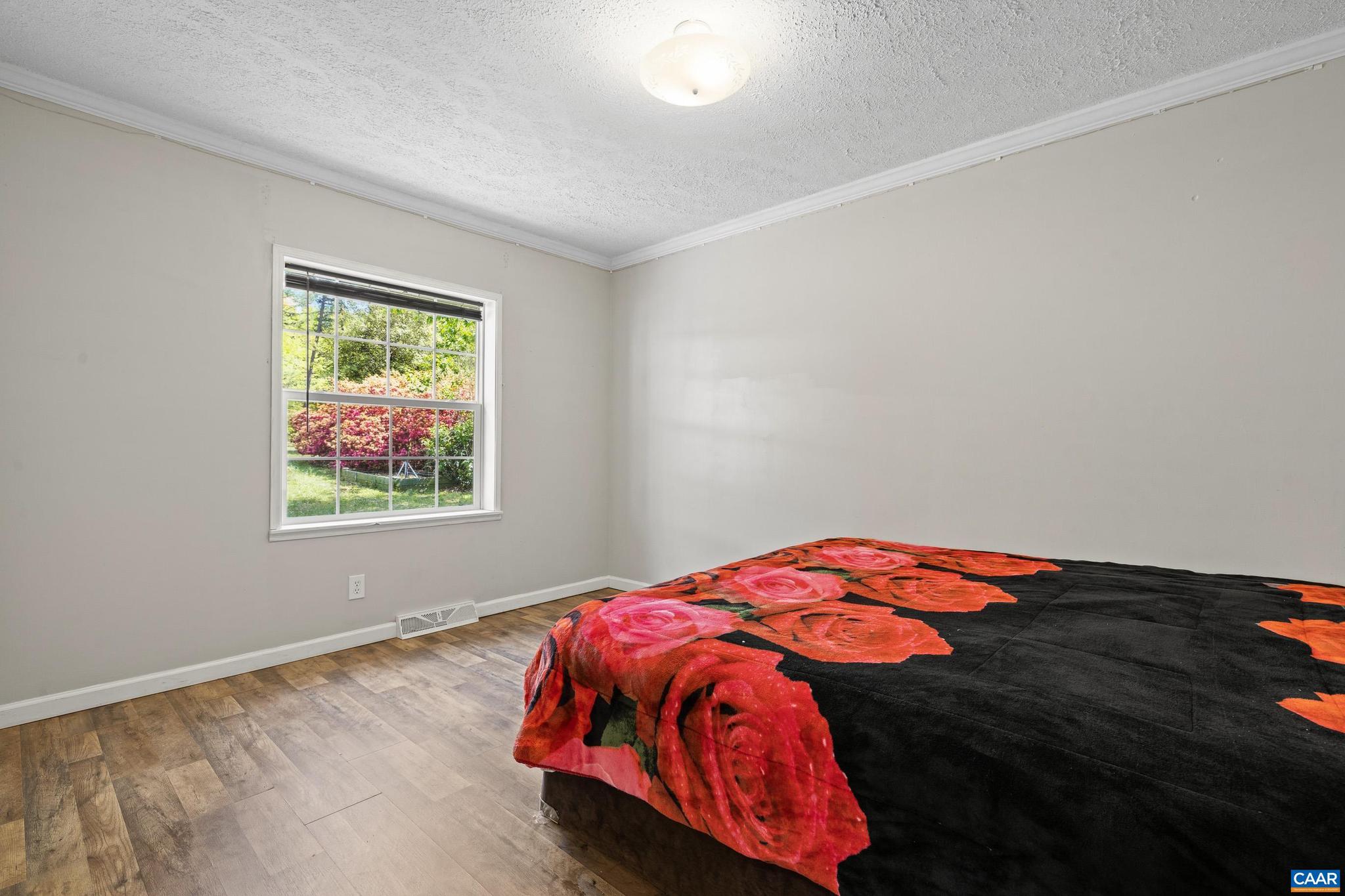 3151 Waldrop Church Road Louisa, VA 23093 - Photo 27 of 42 a bedroom with a bed and a window