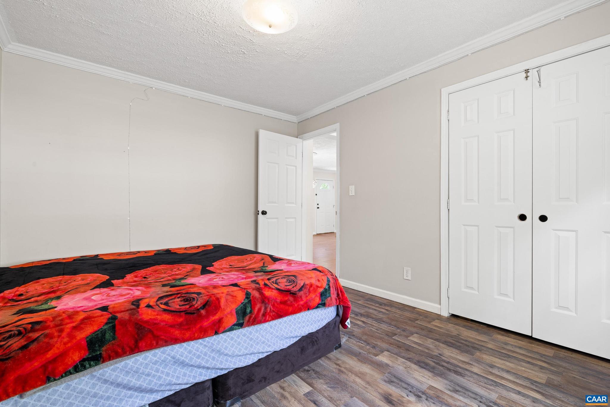 3151 Waldrop Church Road Louisa, VA 23093 - Photo 28 of 42 a bedroom with a bed and wooden floor