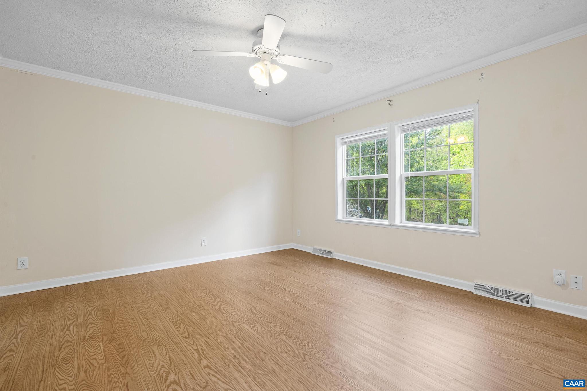 3151 Waldrop Church Road Louisa, VA 23093 - Photo 29 of 42 an empty room with wooden floor and windows