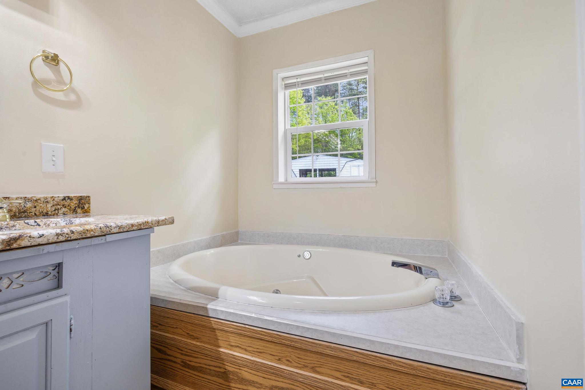 3151 Waldrop Church Road Louisa, VA 23093 - Photo 32 of 42 a white bath tub sitting next to a window